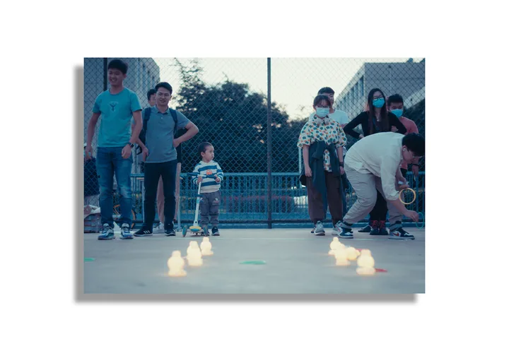 People roller skating between small cones