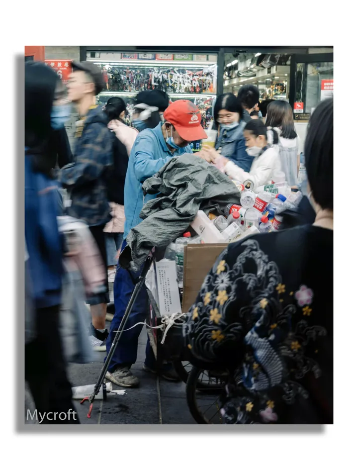 Crowded shop with a display of clothing