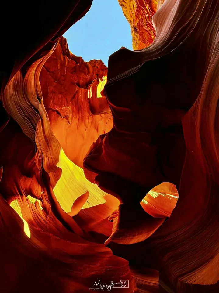 Sunlight on curved red canyon walls